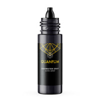 A dark gray bottle of Quantum Dishwater Gray dishwasher cleaner with a black dropper top, featuring a gold geometric logo and text on a white background.