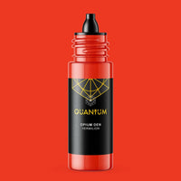 A bottle of Quantum Tattoo Ink Opium Den  is a Vermilion color ink, featuring a vibrant red bottle with a black label and a black dropper cap, set against a solid red background.