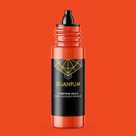 A bottle of Quantum Ink in the 'Pumpkin Head' , which is a dark reddish orange color. The bottle is semi-transparent, showing the orange liquid inside, with a black label featuring a yellow geometric logo and text, and a black dropper cap.