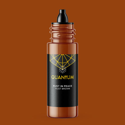 Bottle of Quantum Tattoo Ink -Rust in Peace is Rust Brown color on a brown background with a black label and a black dropper cap, set against a solid rust-brown background.