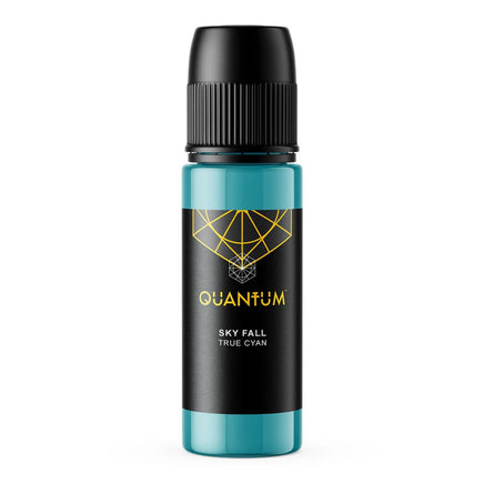 A bottle of Quantum tattoo ink Skye Fall a True Cyan color Ink, featuring a black label and black cap with a gold geometric logo and text, and a translucent teal body, set against a solid white background.