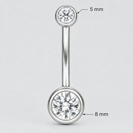 A silver-toned navel piercing barbell stud with a clear round gemstone in the bottom ball, AND A GEMSTONE  IN THE TOP BALL shown on a plain white background.
